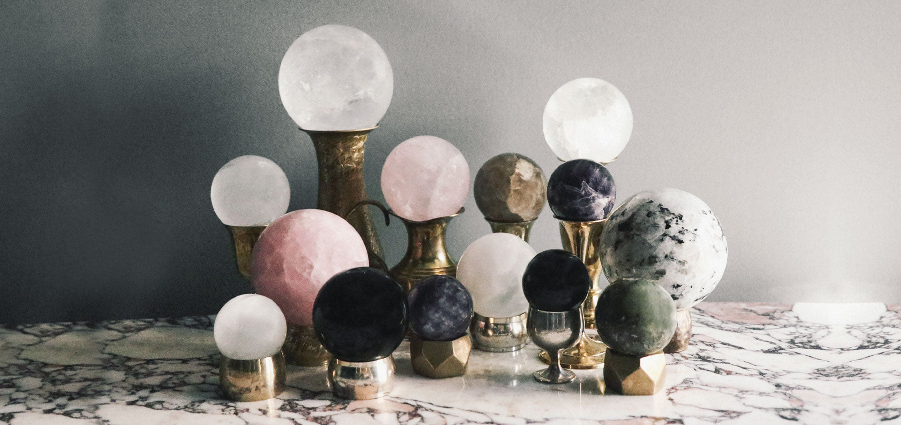 crystal spheres on vintage brass stands